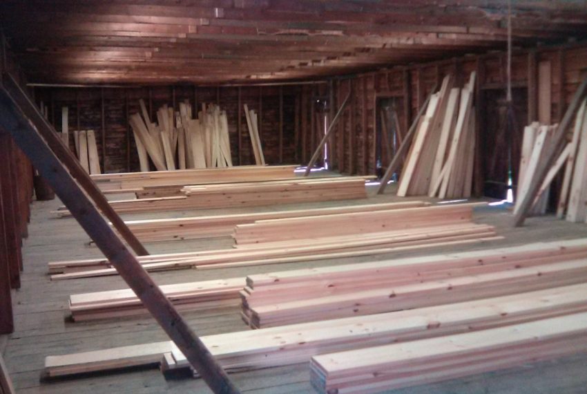 upper space in older lumber storage shed