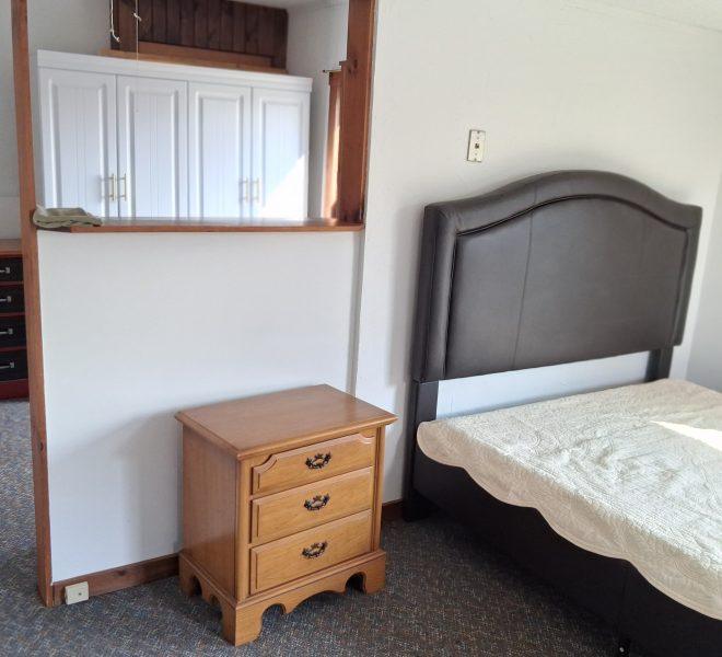 bedroom with end cabinet
