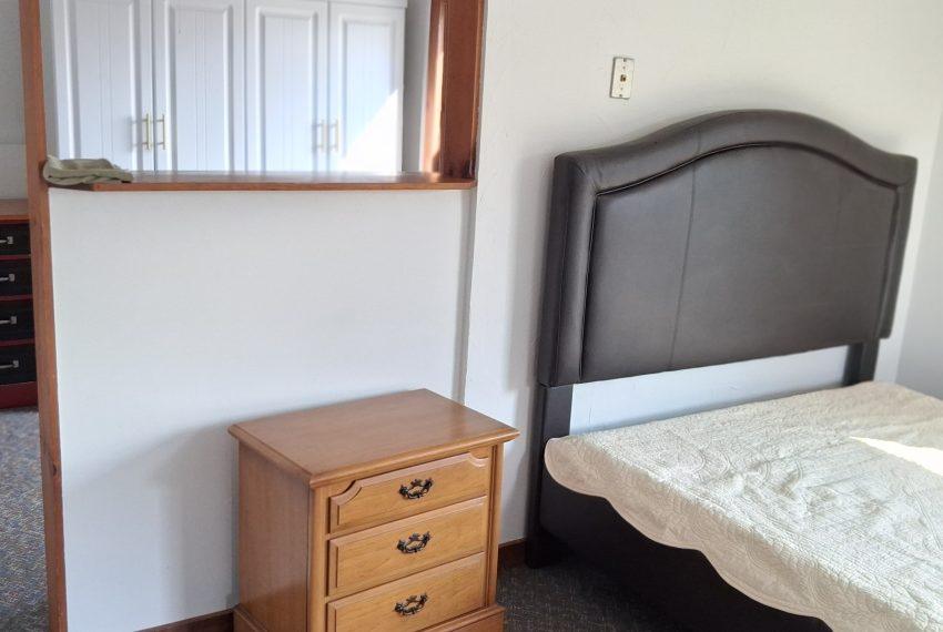 bedroom with end cabinet